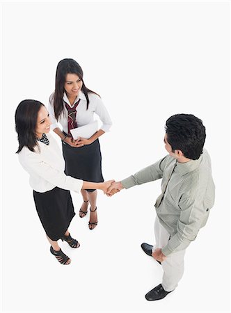 simsearch:630-06722386,k - Business executives shaking hands Stock Photo - Premium Royalty-Free, Code: 630-06722350