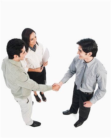 simsearch:630-06722386,k - Business executives shaking hands Stock Photo - Premium Royalty-Free, Code: 630-06722352