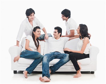 funky man on white background - Friends sitting on a couch and smiling Stock Photo - Premium Royalty-Free, Code: 630-06722415