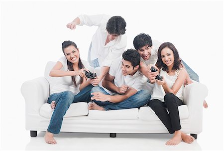 funky man on white background - Friends playing video game Stock Photo - Premium Royalty-Free, Code: 630-06722417