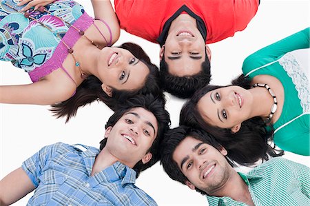 funky young couple studio - High angle view of friends lying on the floor Stock Photo - Premium Royalty-Free, Code: 630-06722463