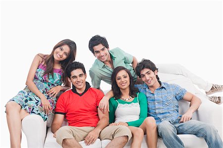 funky young couple studio - Group of friends on a couch Stock Photo - Premium Royalty-Free, Code: 630-06722470