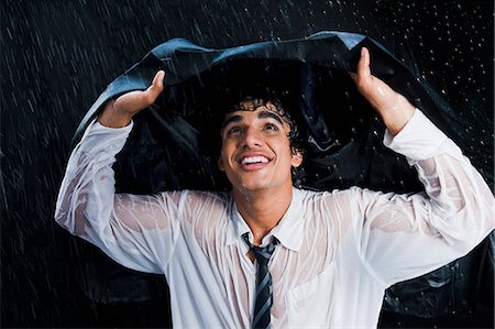 pic of rain with alone man - Businessman enjoying the rain Stock Photo - Premium Royalty-Free, Code: 630-06722631