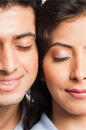 Close-up of a couple smiling Stock Photo - Premium Royalty-Free, Code: 630-06722720