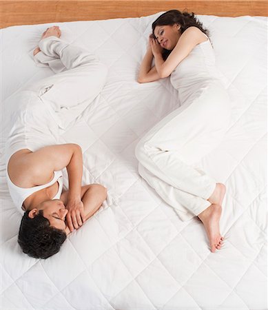 relationship problem - Couple lying on the bed Stock Photo - Premium Royalty-Free, Code: 630-06722795