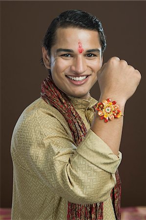 rakhi - Portrait of a man showing his rakhi Stock Photo - Premium Royalty-Free, Code: 630-06722855