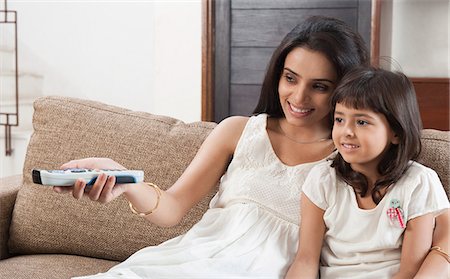 family wireless living room - Woman watching television with her daughter Stock Photo - Premium Royalty-Free, Code: 630-06722985