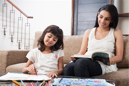 east indian mother and children - Woman looking at her daughter drawing Stock Photo - Premium Royalty-Free, Code: 630-06722991