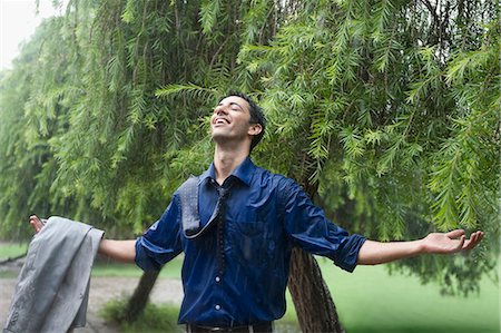 pic of rain with alone man - Businessman enjoying rain Stock Photo - Premium Royalty-Free, Code: 630-06723053