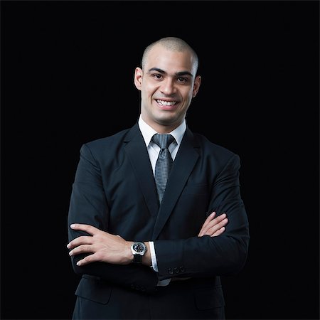 simsearch:630-06723210,k - Portrait of a businessman smiling Foto de stock - Sin royalties Premium, Código: 630-06723168