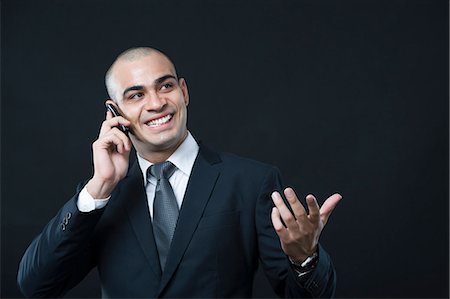 simsearch:630-06723210,k - Close-up of a businessman talking on a mobile phone Foto de stock - Sin royalties Premium, Código: 630-06723177