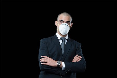 simsearch:630-06723232,k - Businessman wearing a pollution mask Stock Photo - Premium Royalty-Free, Code: 630-06723184