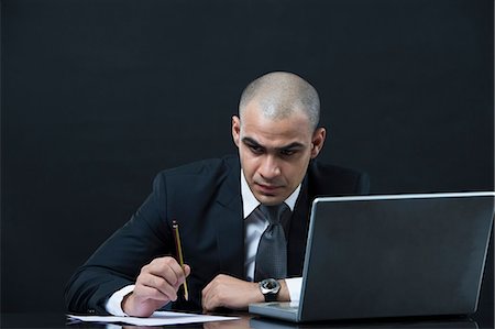 simsearch:630-06723210,k - Businessman working in front of a laptop Foto de stock - Sin royalties Premium, Código: 630-06723196