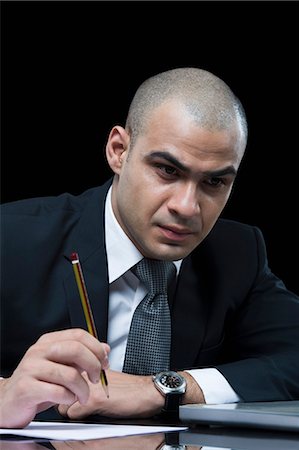 simsearch:630-06723210,k - Businessman working in front of a laptop Foto de stock - Sin royalties Premium, Código: 630-06723197