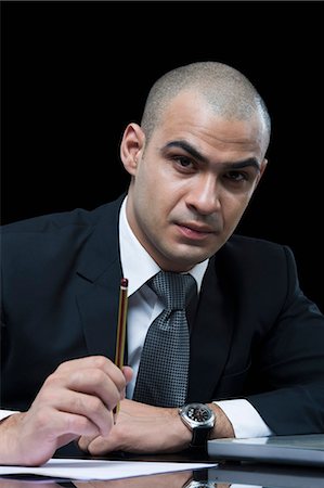 simsearch:630-06723210,k - Portrait of a businessman working in front of a laptop Foto de stock - Sin royalties Premium, Código: 630-06723198