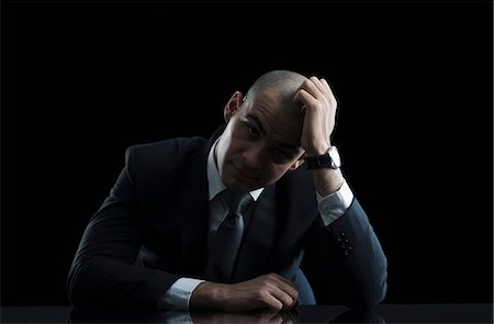 simsearch:630-06723232,k - Portrait of a businessman looking worried Stock Photo - Premium Royalty-Free, Code: 630-06723190