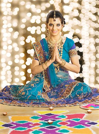 festive - Woman greeting in prayer position near rangoli at Diwali festival Stock Photo - Premium Royalty-Free, Code: 630-06723559