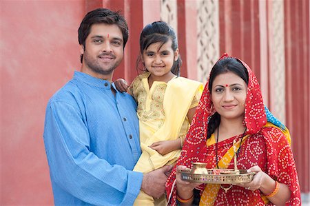 standing photos of girls in saree - Rural family praying in a temple, Sohna, Haryana, India Stock Photo - Premium Royalty-Free, Code: 630-07071157