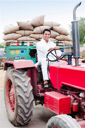 simsearch:6113-07565377,k - Man driving a tractor loaded with wheat sacks in a grains market, Anaj Mandi, Sohna, Gurgaon, Haryana, India Stock Photo - Premium Royalty-Free, Code: 630-07071190