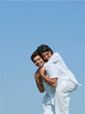 simsearch:614-02259772,k - Man carried his girlfriend piggyback in a park, Japanese Park, Rohini, Delhi, India Stock Photo - Premium Royalty-Free, Code: 630-07071219