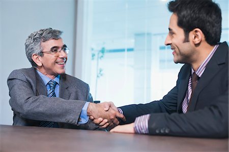 Businessman shaking hands with another businessman Stock Photo - Premium Royalty-Free, Code: 630-07071494