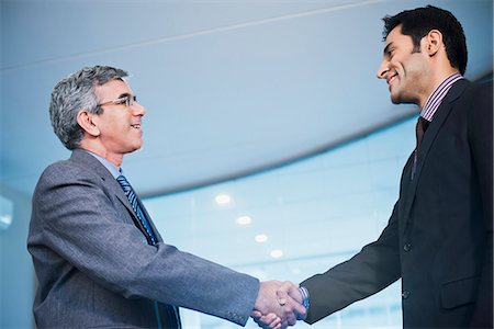 Businessman shaking hands with another businessman Stock Photo - Premium Royalty-Free, Code: 630-07071496