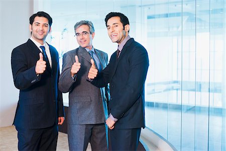 Businessmen showing thumbs up Stock Photo - Premium Royalty-Free, Code: 630-07071504