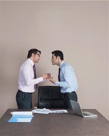 Two businessmen fighting to each other Stock Photo - Premium Royalty-Free, Code: 630-07071548