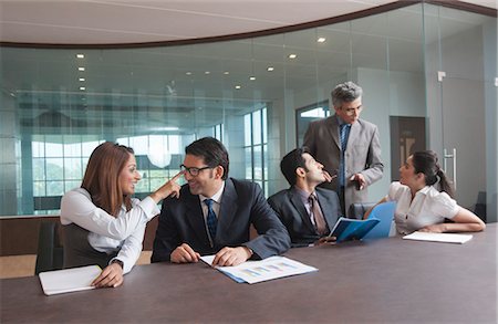 simsearch:630-07071558,k - Business executives discussing in a meeting Stock Photo - Premium Royalty-Free, Code: 630-07071581