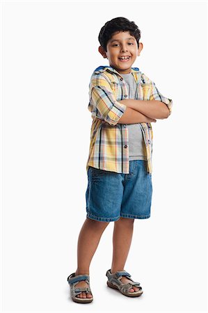 Boy standing with his arms crossed Foto de stock - Sin royalties Premium, Código: 630-07071765