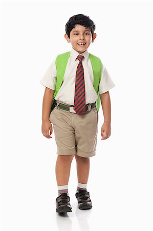 school uniform full length looking at camera - Schoolboy smiling Stock Photo - Premium Royalty-Free, Code: 630-07071784