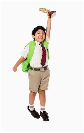 portrait images of happy kids - Schoolboy holding a trophy Stock Photo - Premium Royalty-Free, Code: 630-07071787