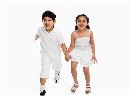 siblings isolated - Children running and playing Stock Photo - Premium Royalty-Free, Code: 630-07071805