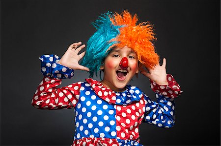 payaso (hombre y mujer) - Boy imitating like a clown Foto de stock - Sin royalties Premium, Código: 630-07071825