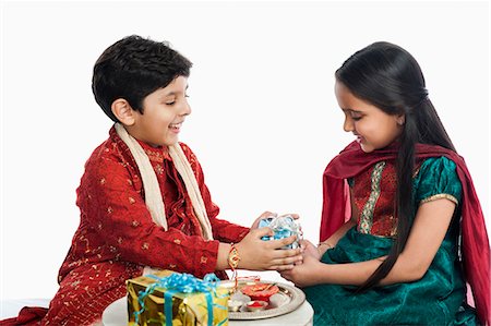 simsearch:630-06723775,k - Boy giving gift to his sister at Raksha Bhandan Stock Photo - Premium Royalty-Free, Code: 630-07071822