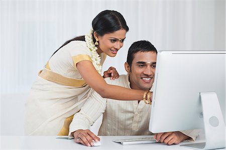 simsearch:630-07071840,k - South Indian couple using a desktop computer Stock Photo - Premium Royalty-Free, Code: 630-07071843