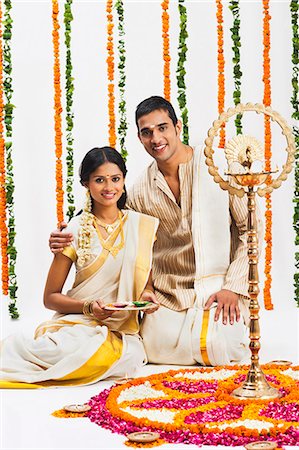simsearch:630-07071984,k - South Indian couple near a rangoli of flowers at Onam Stock Photo - Premium Royalty-Free, Code: 630-07071876