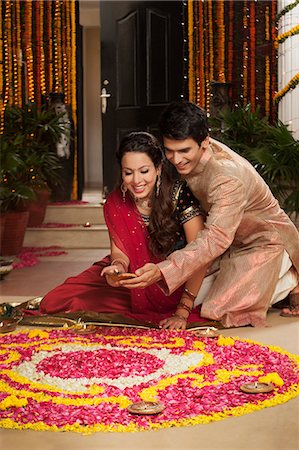 diwali couple pic - Couple making rangoli on Diwali Stock Photo - Premium Royalty-Free, Code: 630-07072057