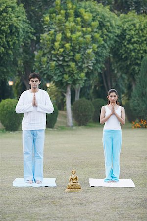 Portrait of a young couple standing in a prayer position Stock Photo - Premium Royalty-Free, Code: 630-01075622