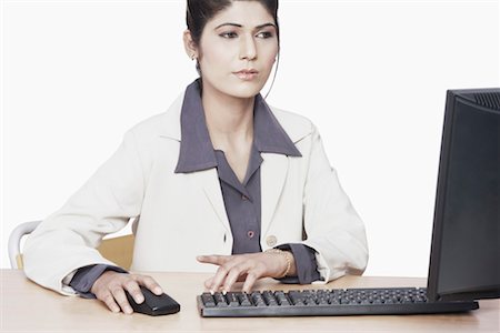 formal mouse computer - Close-up of a businesswoman sitting in front of a computer Stock Photo - Premium Royalty-Free, Code: 630-01075717