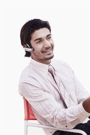 simsearch:630-01128257,k - Close-up of a businessman wearing a hands free device Stock Photo - Premium Royalty-Free, Code: 630-01075770