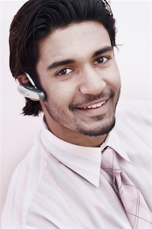 simsearch:630-01128257,k - Portrait of a businessman wearing a hands free device Stock Photo - Premium Royalty-Free, Code: 630-01075771