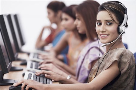 simsearch:630-01076251,k - Portrait of a businesswoman sitting in front of a computer Stock Photo - Premium Royalty-Free, Code: 630-01075821