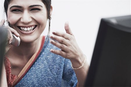 simsearch:630-01075851,k - Close-up of a businesswoman talking on a mobile phone Stock Photo - Premium Royalty-Free, Code: 630-01075851