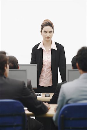 formal mouse computer - Portrait of a businesswoman giving a presentation Stock Photo - Premium Royalty-Free, Code: 630-01076072