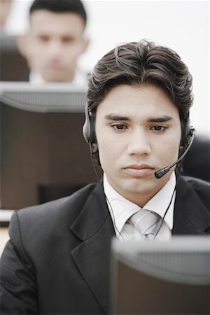 simsearch:630-01076251,k - Close-up of a businessman wearing a headset Stock Photo - Premium Royalty-Free, Code: 630-01076110