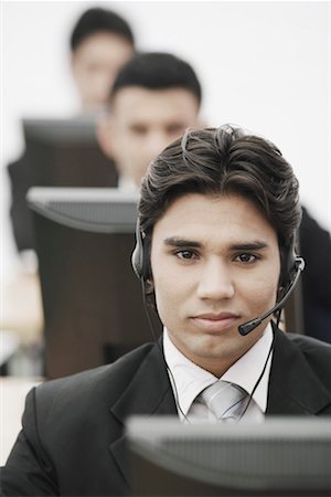 simsearch:630-01076251,k - Portrait of a businessman wearing a headset Stock Photo - Premium Royalty-Free, Code: 630-01076111