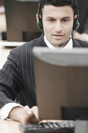 simsearch:630-01076251,k - Close-up of a businessman wearing a headset Stock Photo - Premium Royalty-Free, Code: 630-01076112