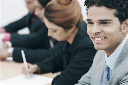 simsearch:630-01076251,k - Close-up of a businessmen sitting in a conference room Stock Photo - Premium Royalty-Free, Code: 630-01076218