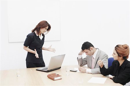 people in meeting room angry - Businesswoman shouting at a businessman Stock Photo - Premium Royalty-Free, Code: 630-01076232